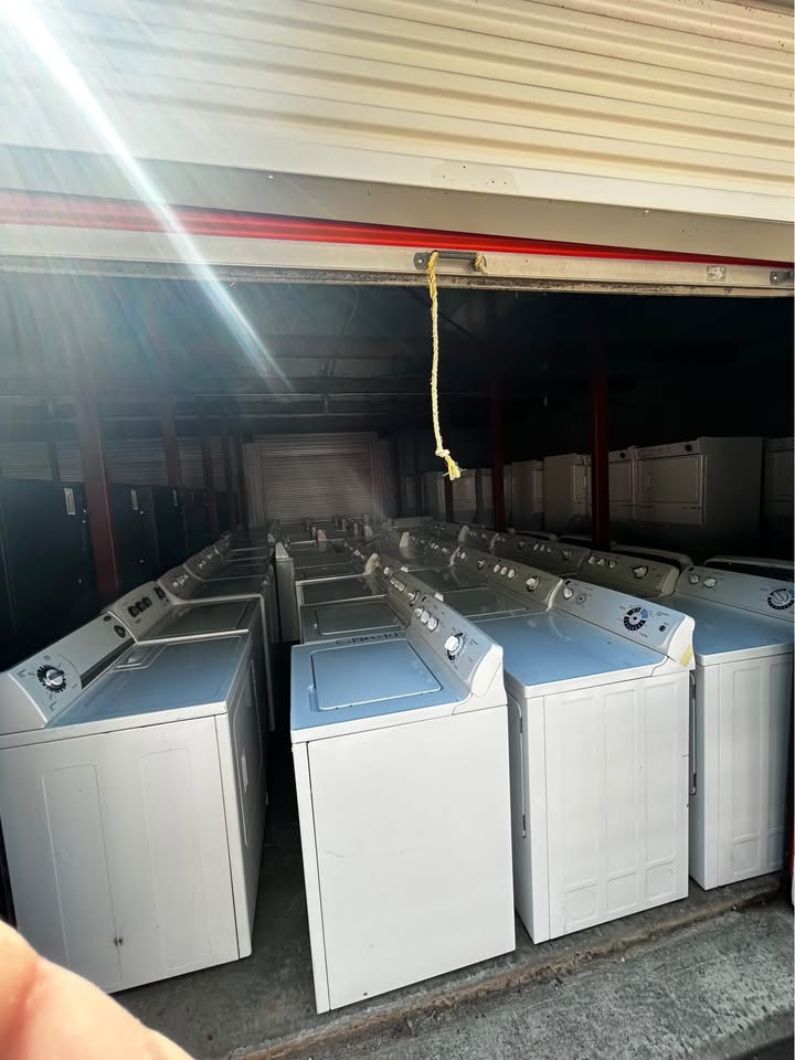 Row of top-load washers in stock